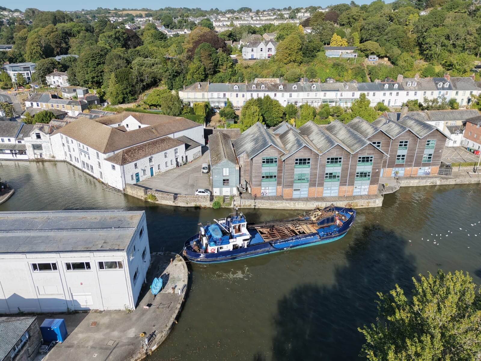 The Mannin under way on the Truro River between the quays