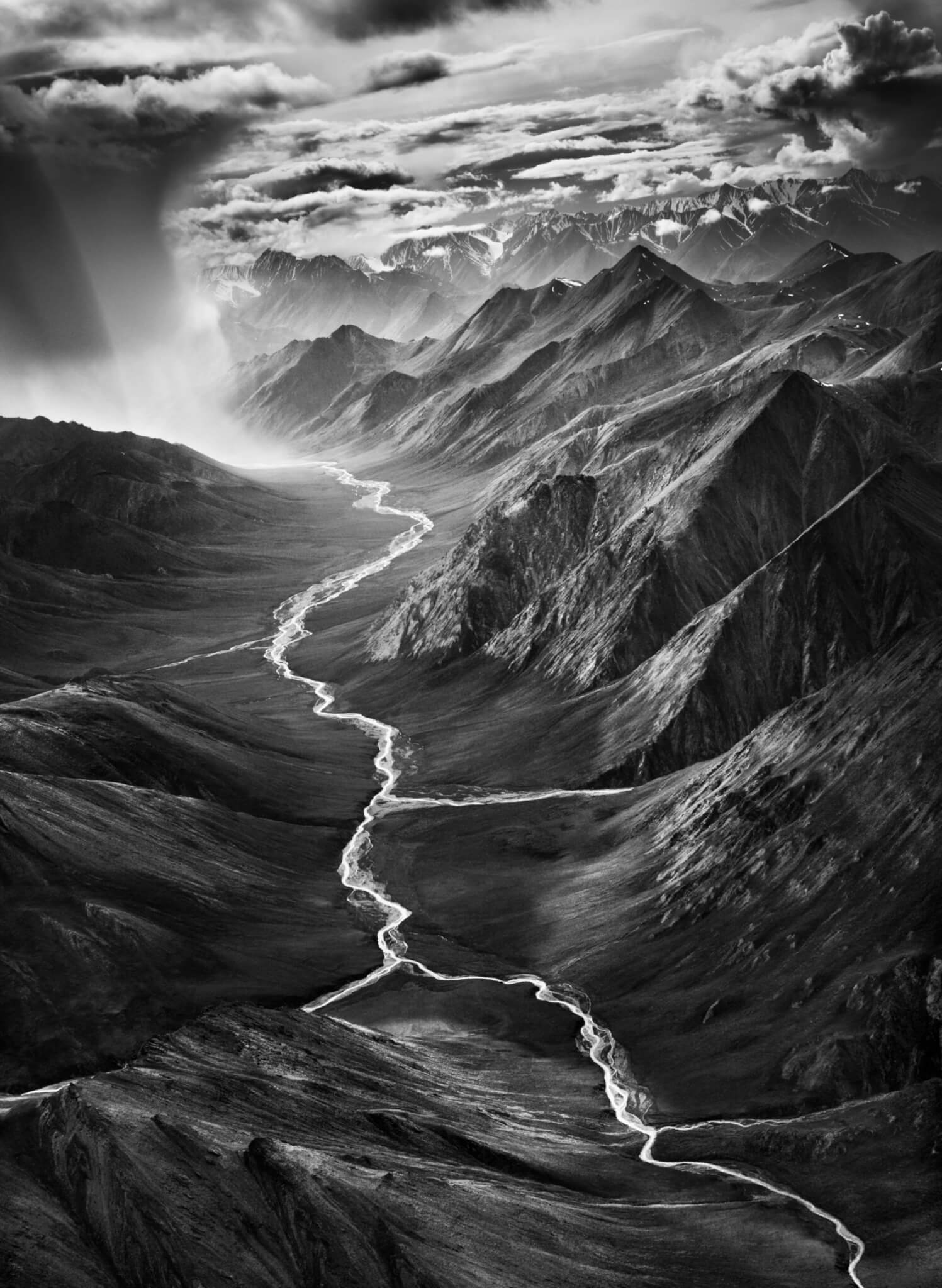 Sebastiao Salgado black-and-white photograph of a braided river winding through the Brooks Range mountains in Alaska