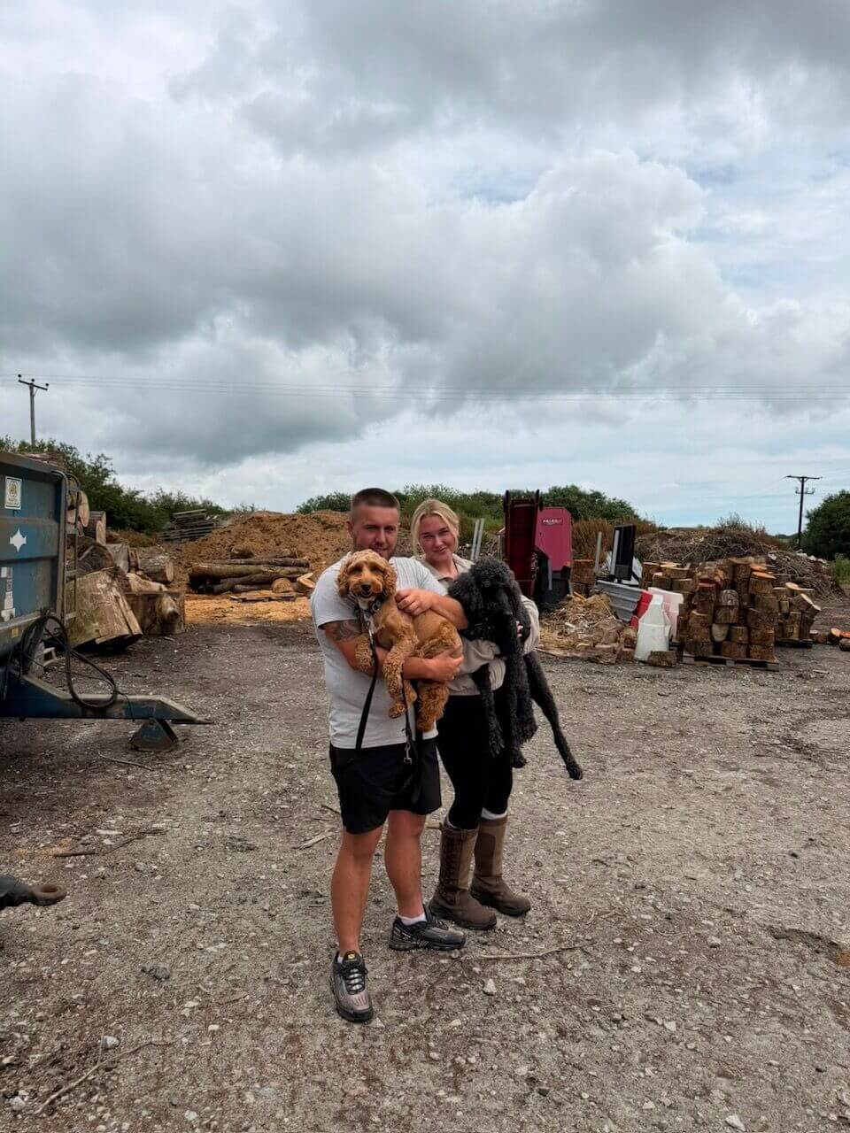 Molly and Louis holding their dog Matilda