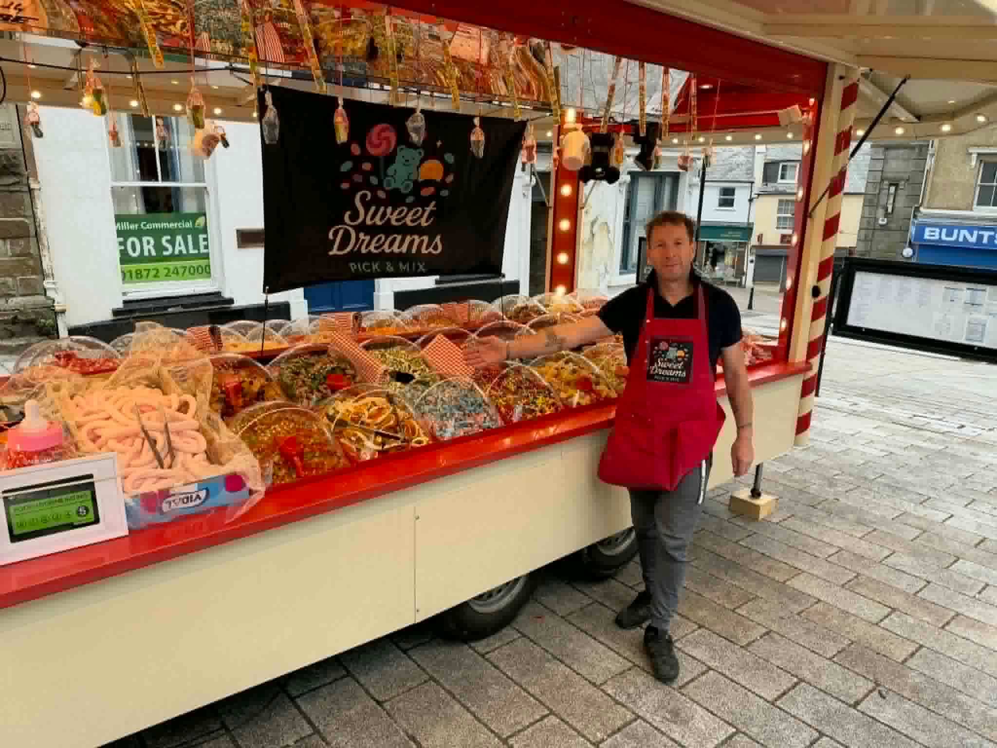 A trader at the Sweet Dreams Pick and Mix cart in Bodmin