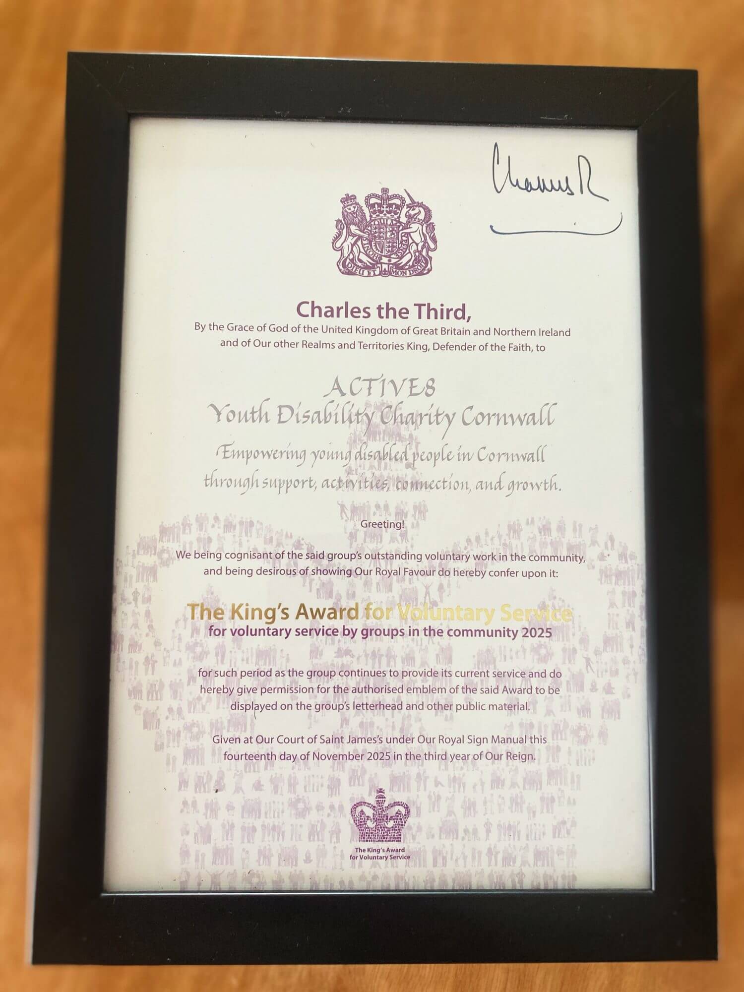 The King's Award for Voluntary Service certificate signed by King Charles III