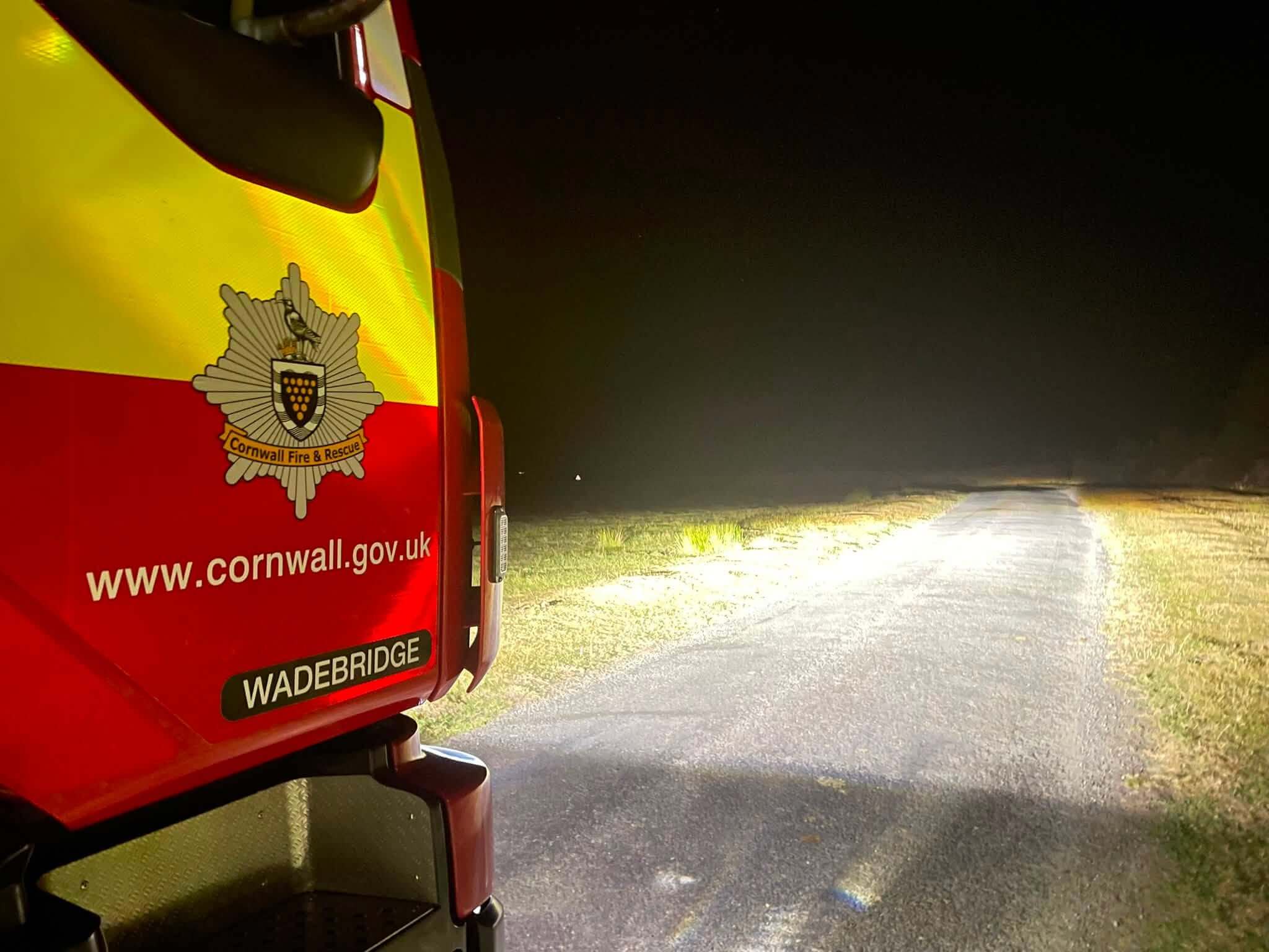 Wadebridge Cornwall Fire and Rescue engine on open land at night