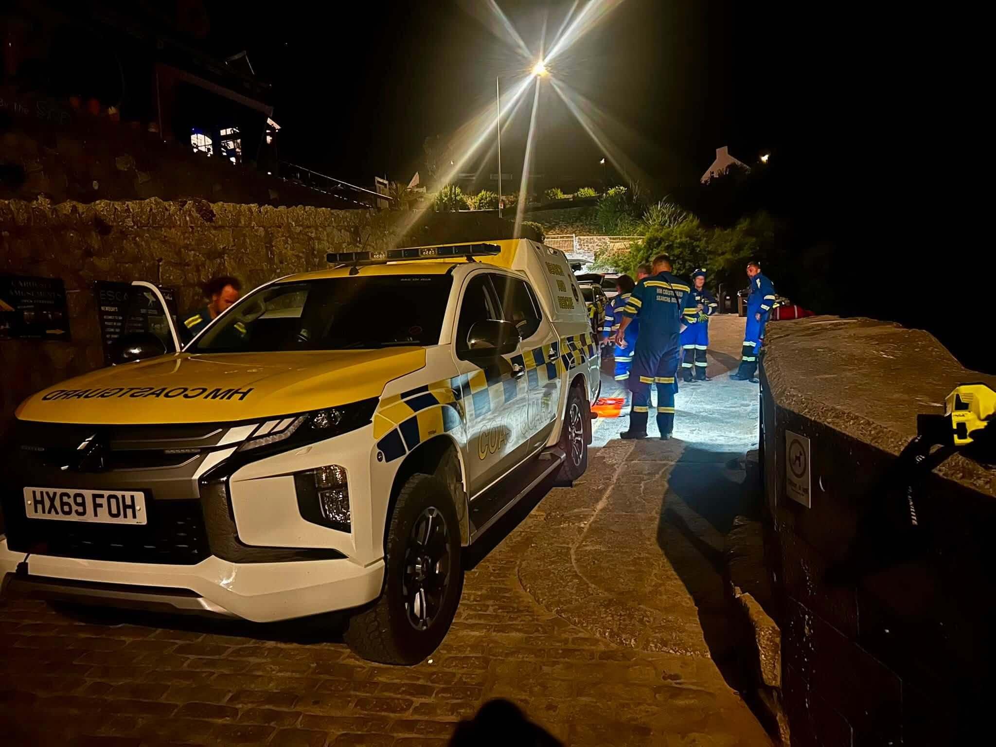 HM Coastguard search and rescue vehicle at the scene of a night callout in Newquay