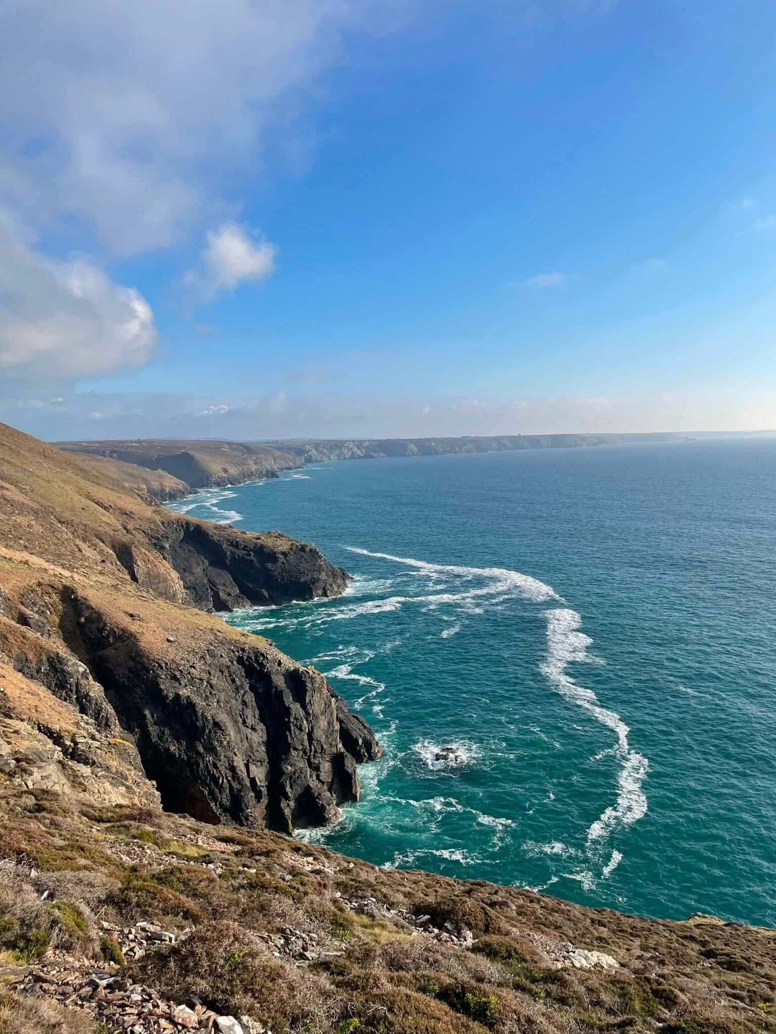 Cliffs and wind-streaked sea on the Cornwall coast near Portreath