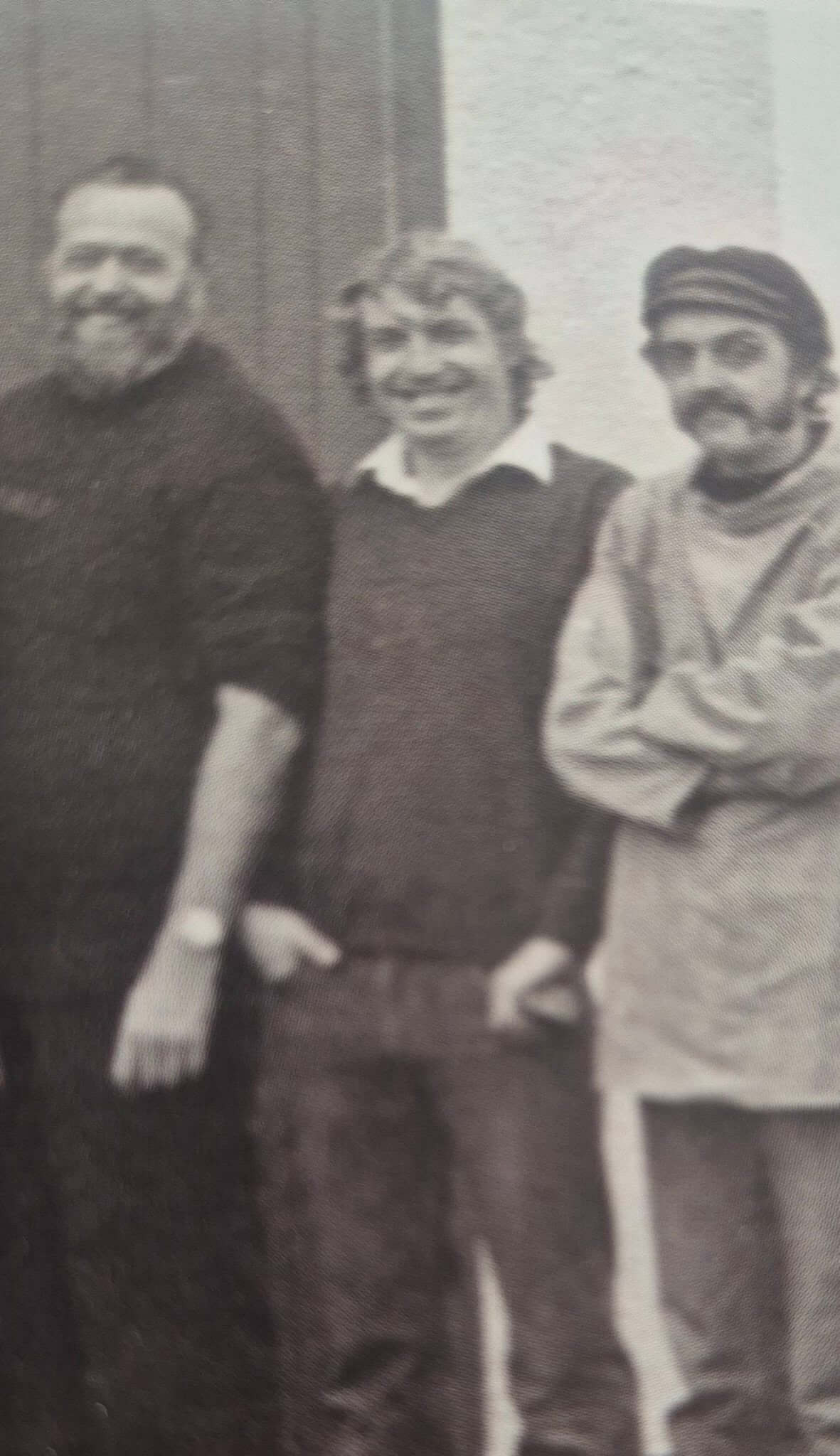 Three Falmouth lifeboat volunteers standing together, Snowy Angove in the centre