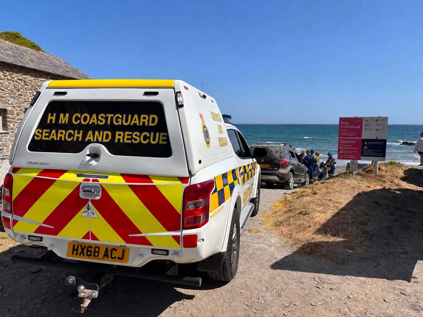 HM Coastguard Search and Rescue vehicle parked above the beach at West Portholland