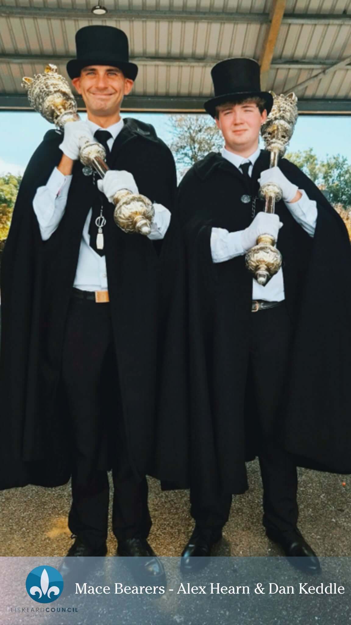 Mace bearers Alex Hearn and Dan Keddle carrying silver maces at the Liskeard parade