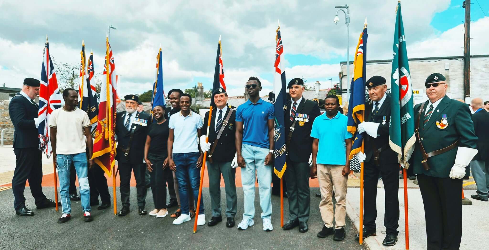 A wider group with flags gathered for the Liskeard RNA anniversary event