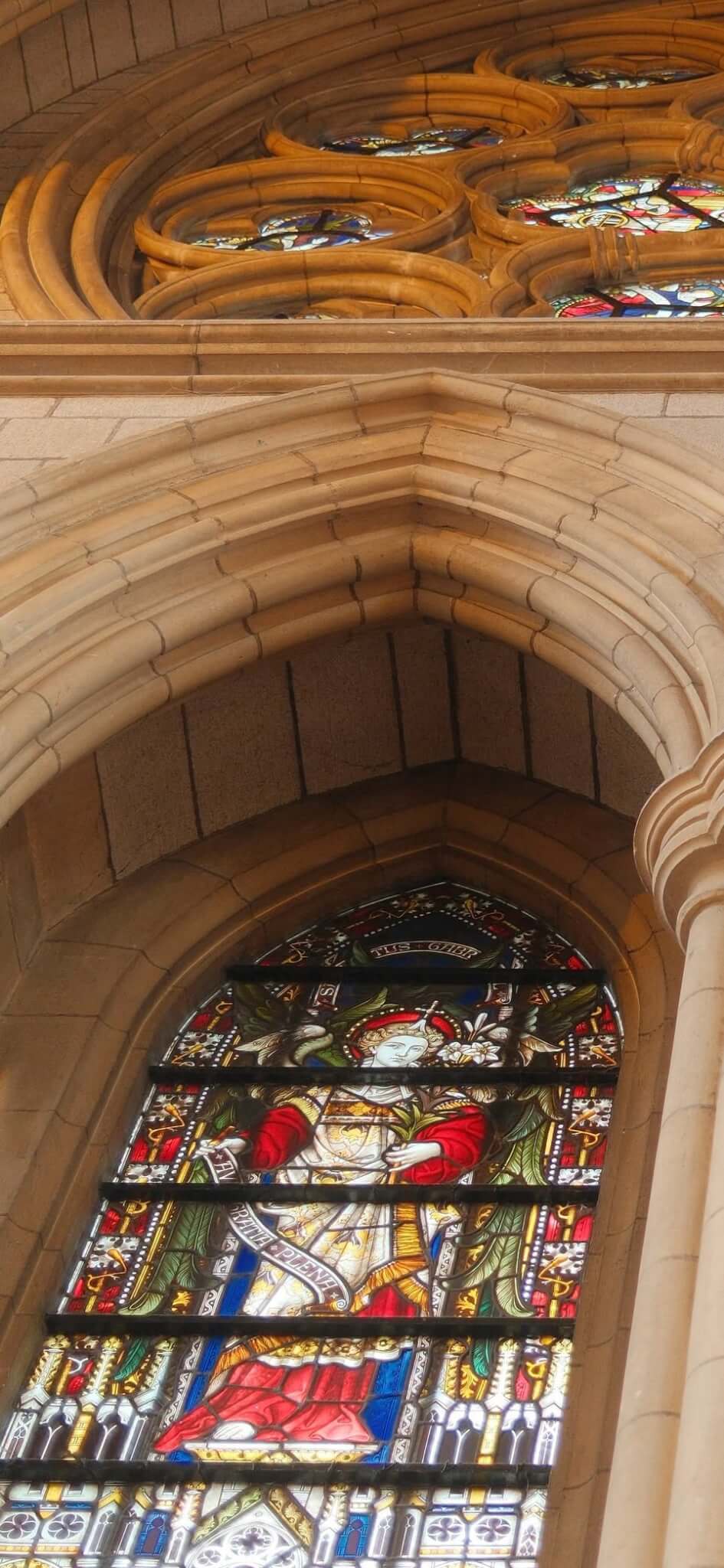 Stained glass and stone tracery seen from above on the Truro Cathedral roof tour
