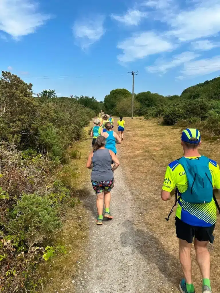 Carn Runners strung out along a dusty trail through the countryside