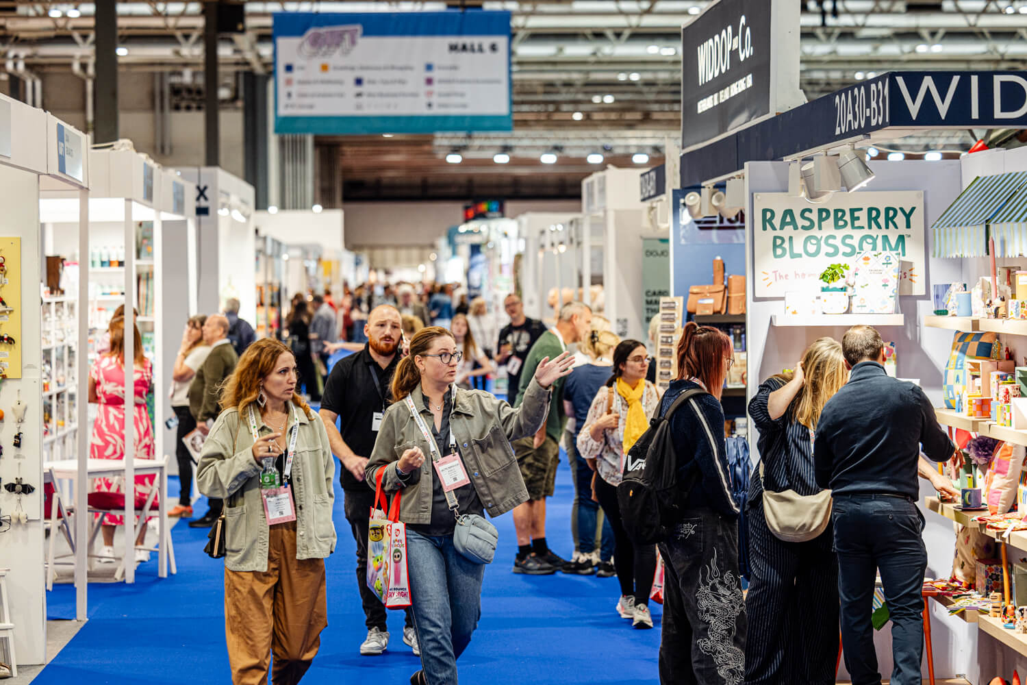 Crowds of buyers walking the aisles at Autumn Fair trade show