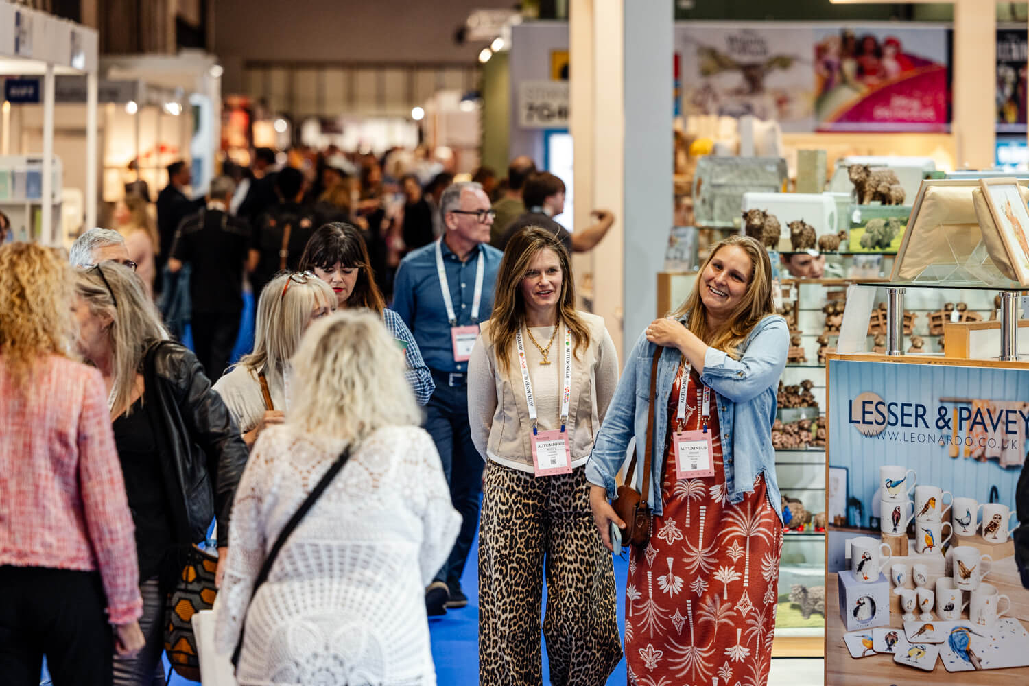 Buyers talking at an Autumn Fair exhibitor stand