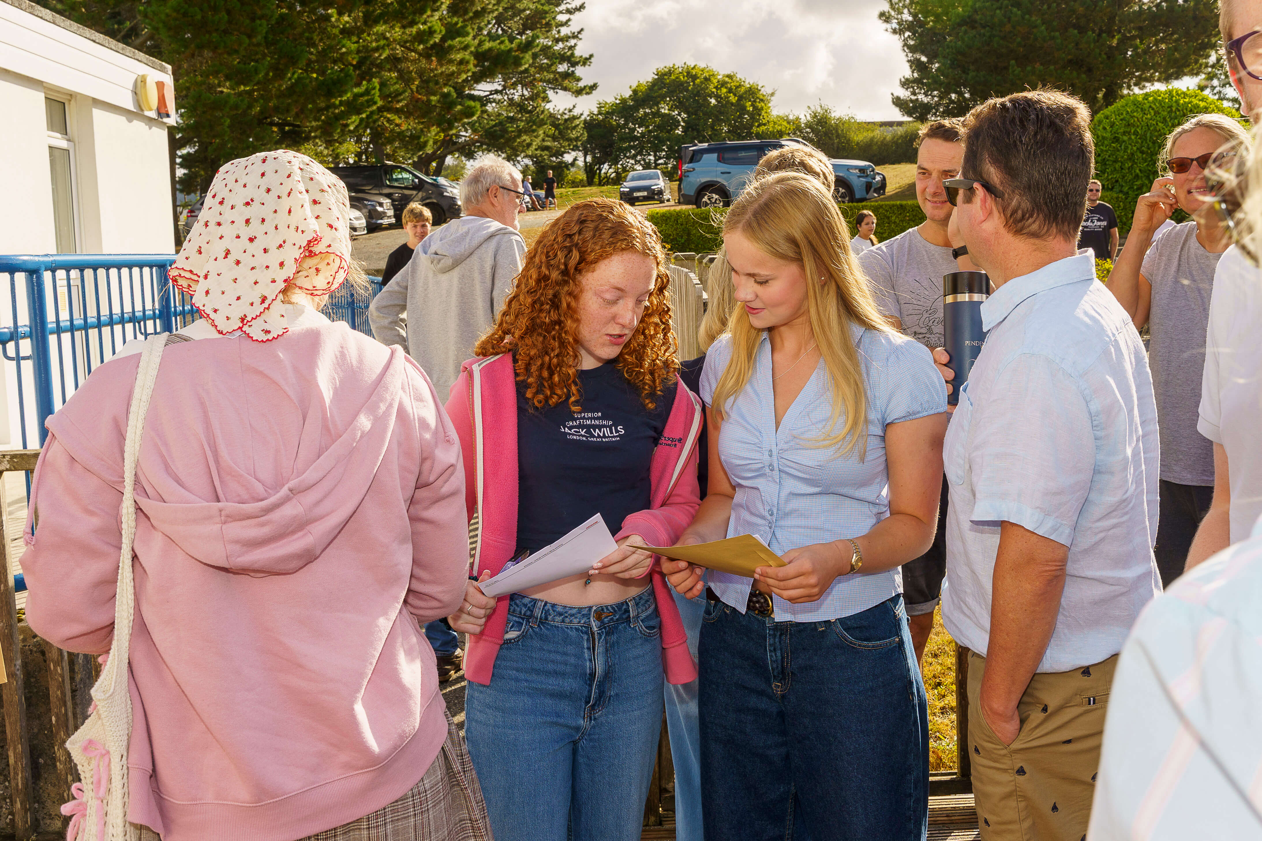 Students celebrating GCSE results outside The Roseland Academy