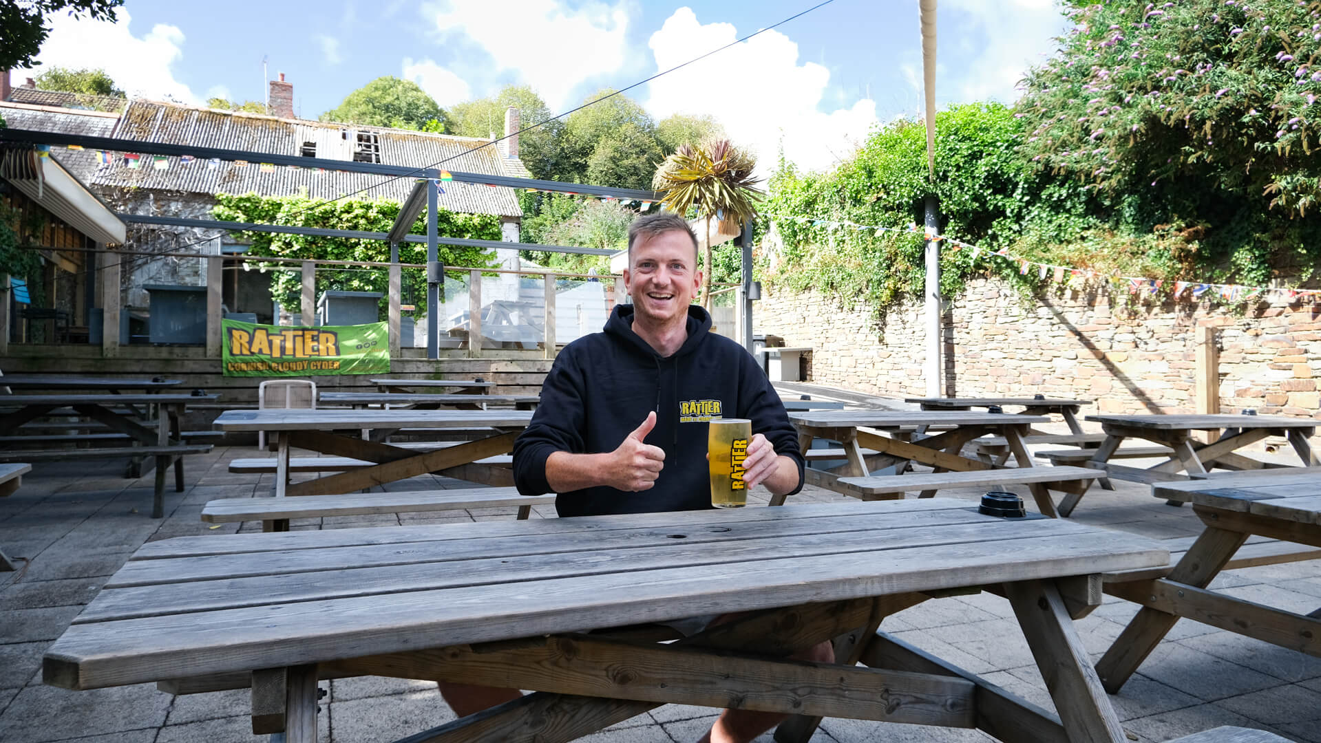 Picnic tables in the Fives Cyderhouse beer garden, Falmouth