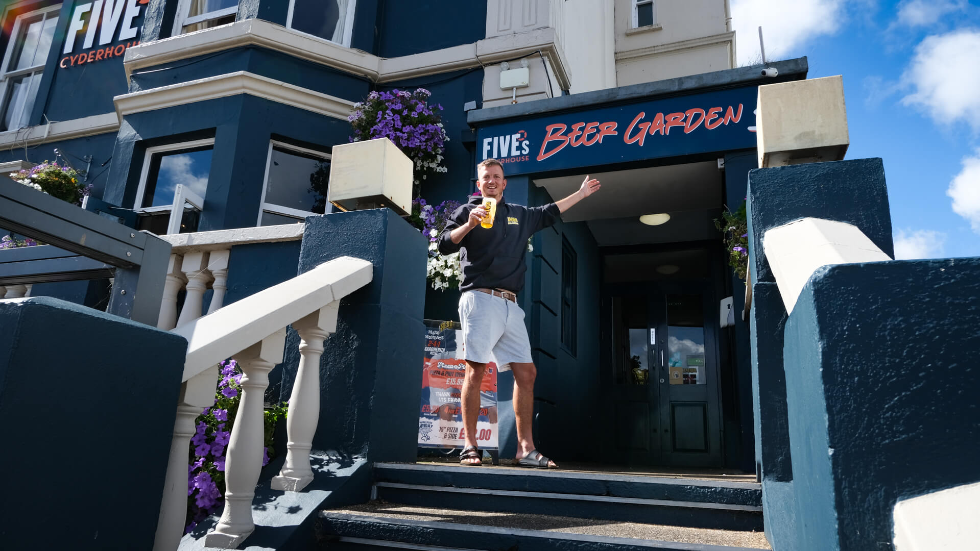 Fives Cyderhouse team member outside the Beer Garden entrance