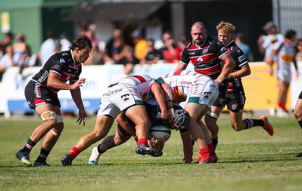 Cornish Pirates and Plymouth Albion players in a tackle contest at Brickfields