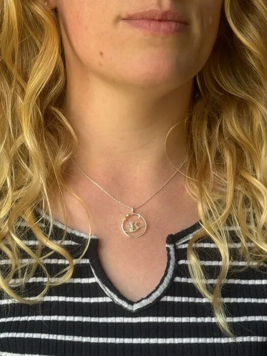 Close-up of a Reeves and Reeves pendant necklace