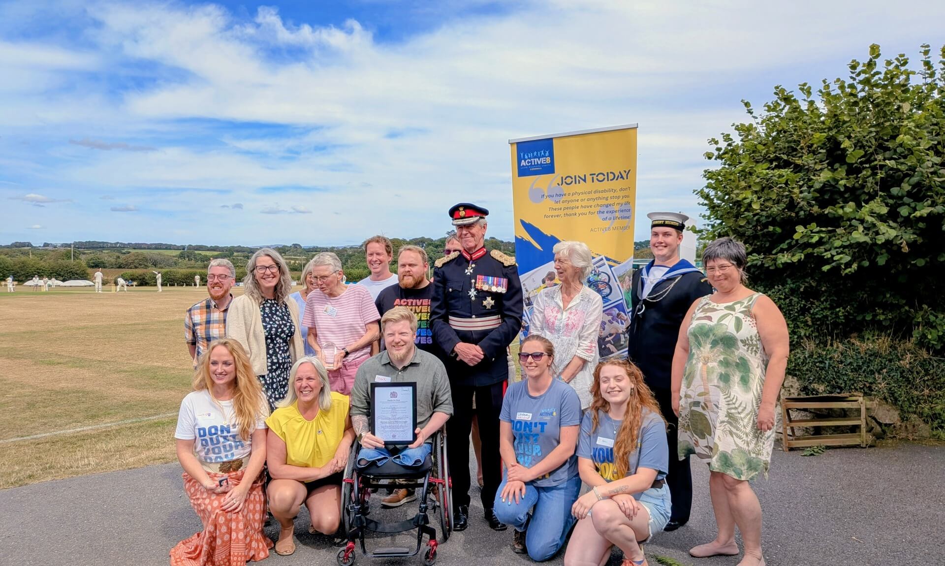 Active8 members, volunteers and the Lord-Lieutenant of Cornwall with the ACTIVE8 banner