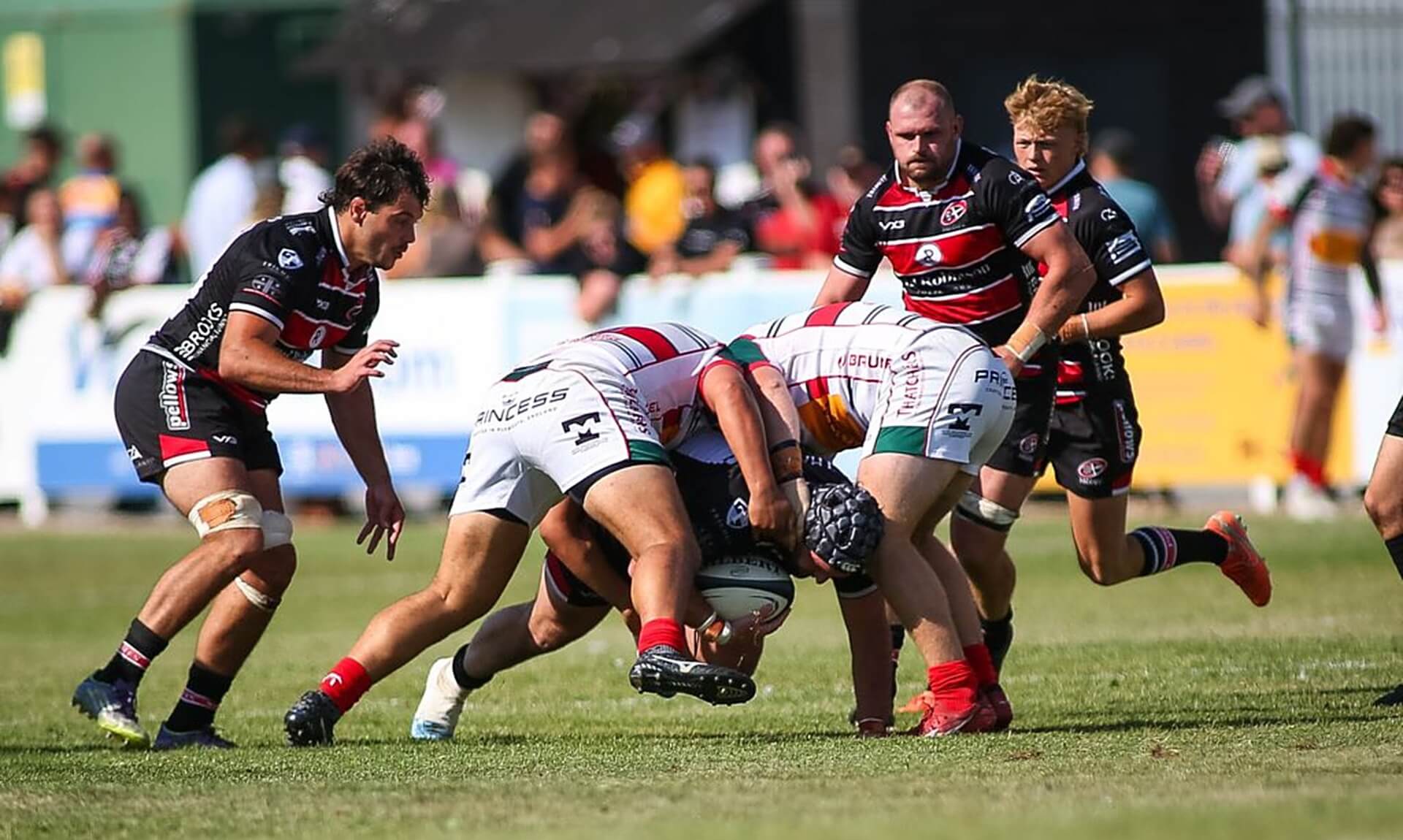 Cornish Pirates and Plymouth Albion players in a tackle contest at Brickfields
