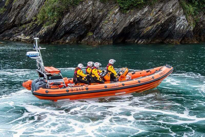 RNLI Looe Atlantic 85 inshore lifeboat Spirit of Cooperation with crew at sea