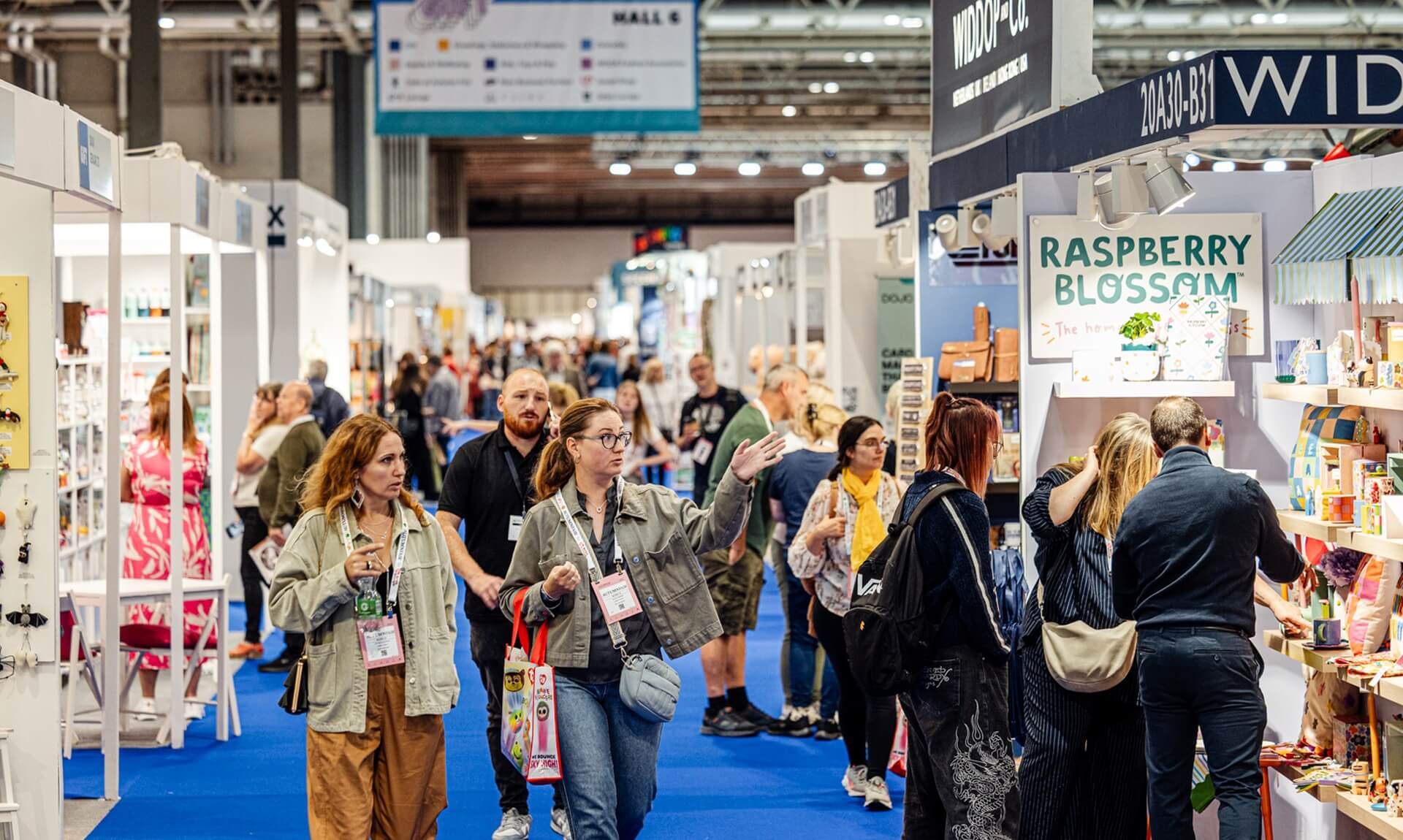 Crowds of buyers walking the aisles at Autumn Fair trade show