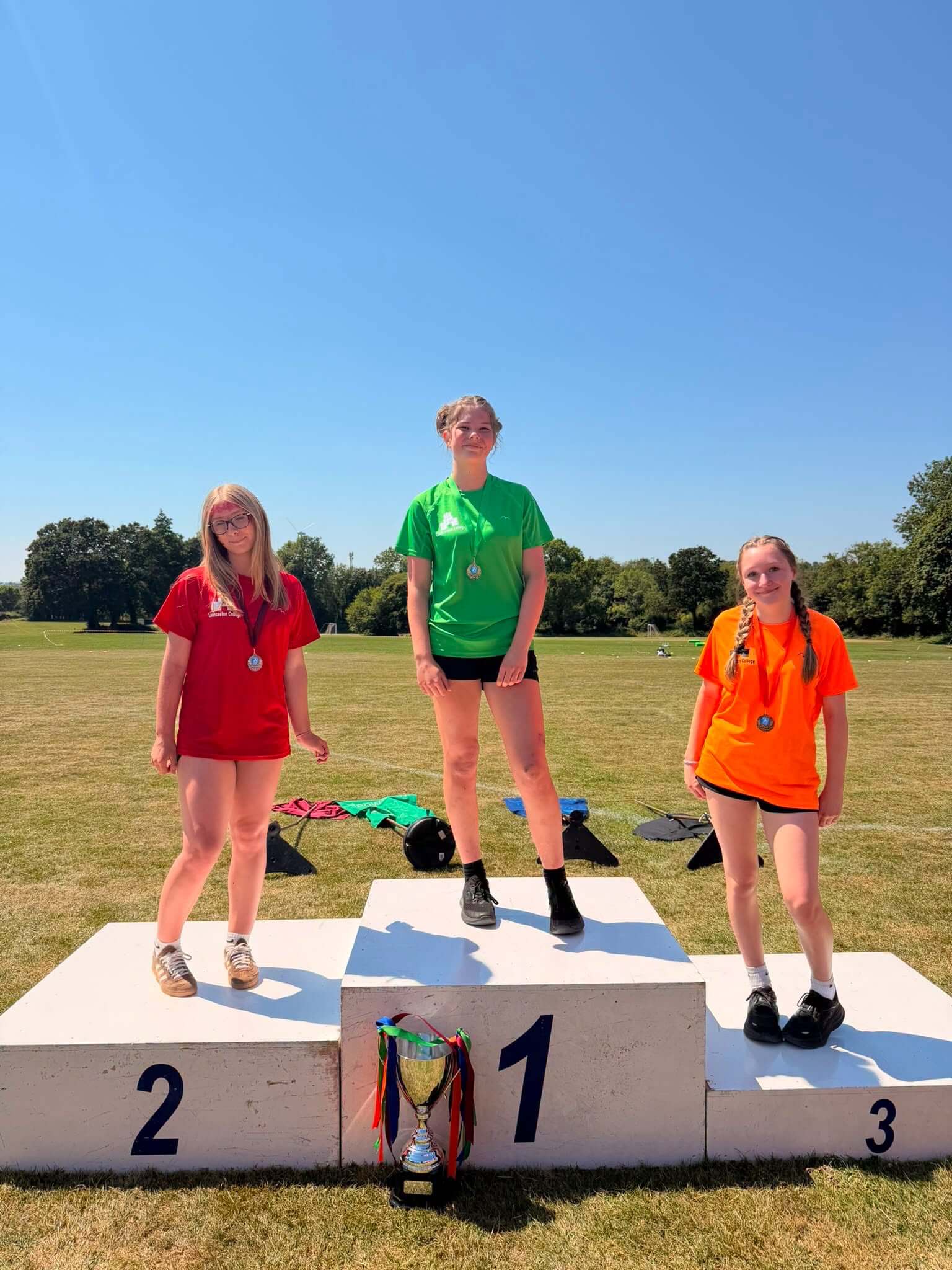 Winners celebrate on the podium at Launceston College sports day