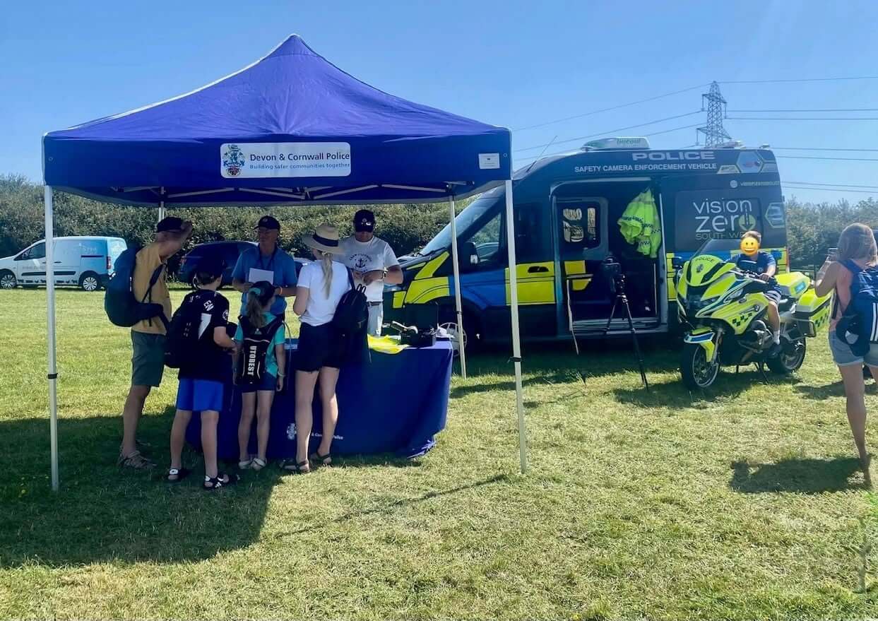 The Devon and Cornwall Police Road Safety Team gazebo, safety camera van and police motorcycle at the Camelford Show