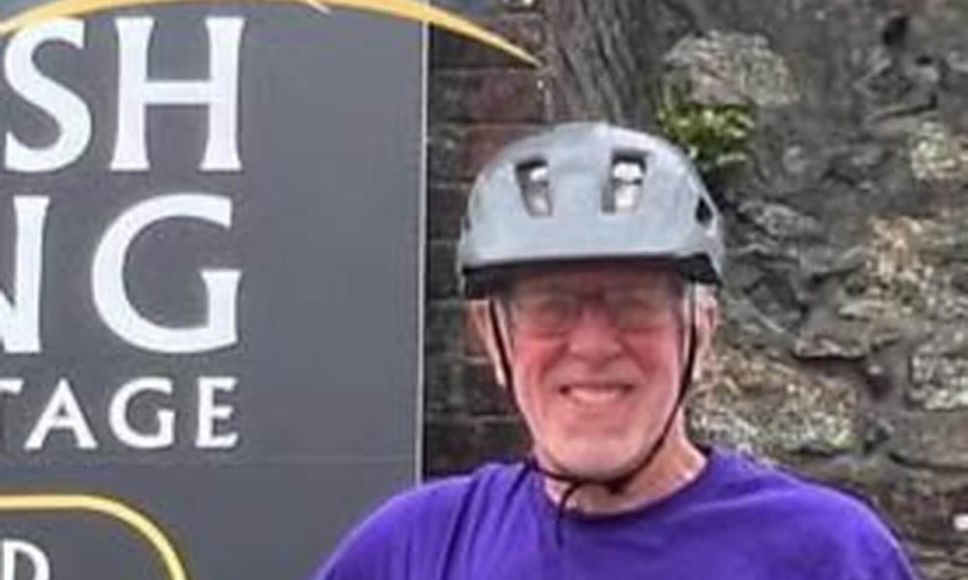 Clifford Poultney in cycling helmet and Georgia's Voice t-shirt