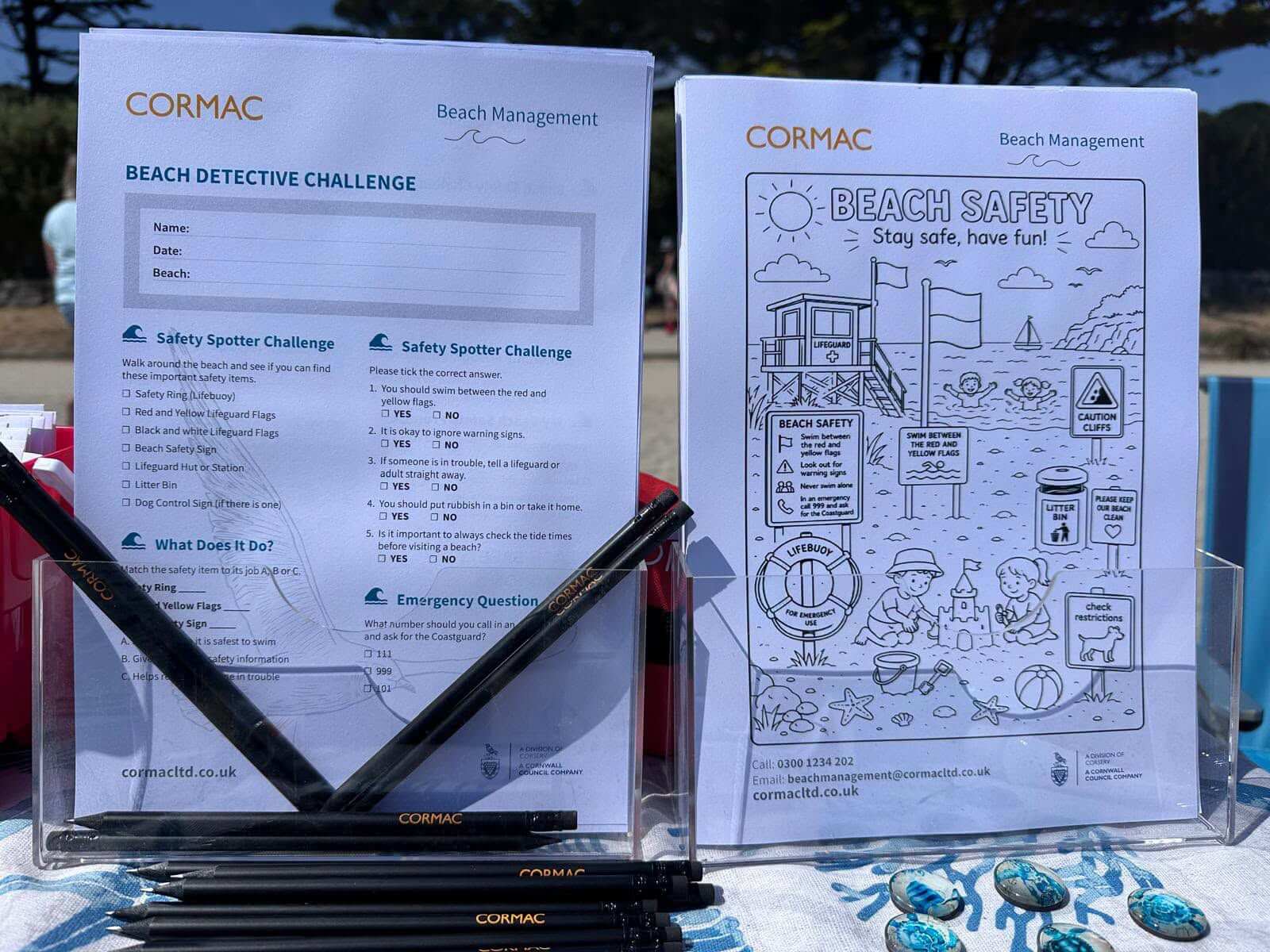 Cormac's Beach Detective Challenge quiz and Beach Safety colouring sheets on a table