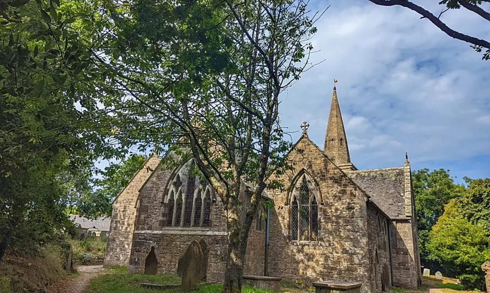 St Hilary church among trees on the St Hilary and Hayle Valley walk