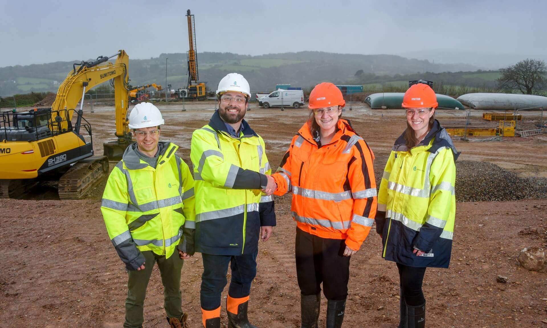 Cornish Lithium and Halliburton staff shake hands at the Cross Lanes drill site
