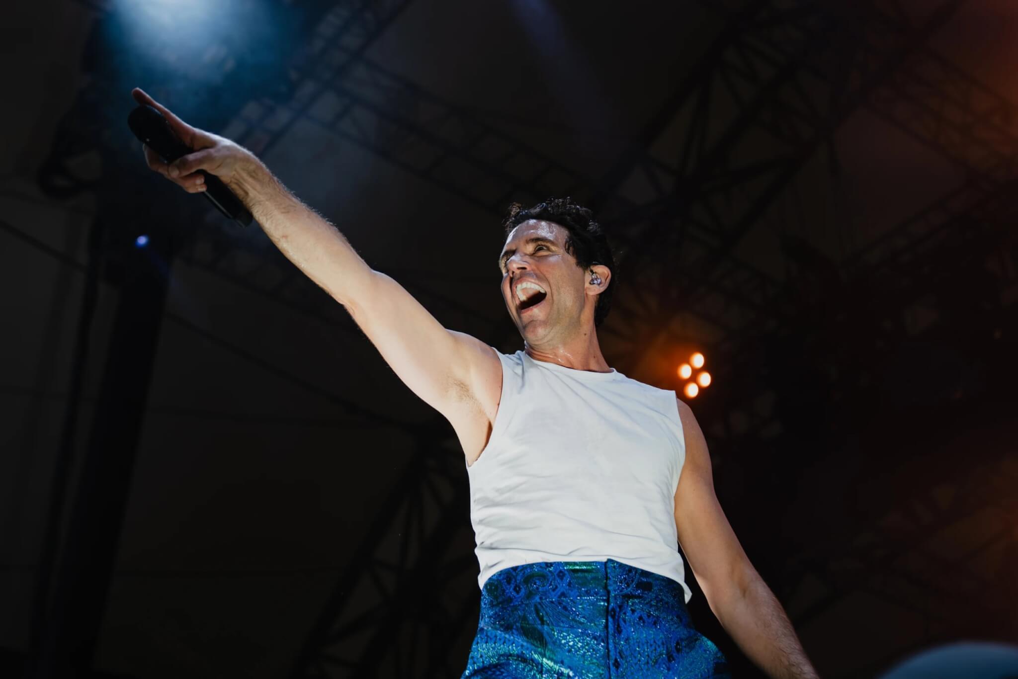 MIKA performing in a white vest with arm outstretched at the Eden Sessions 2026 (photo Rob Donald)