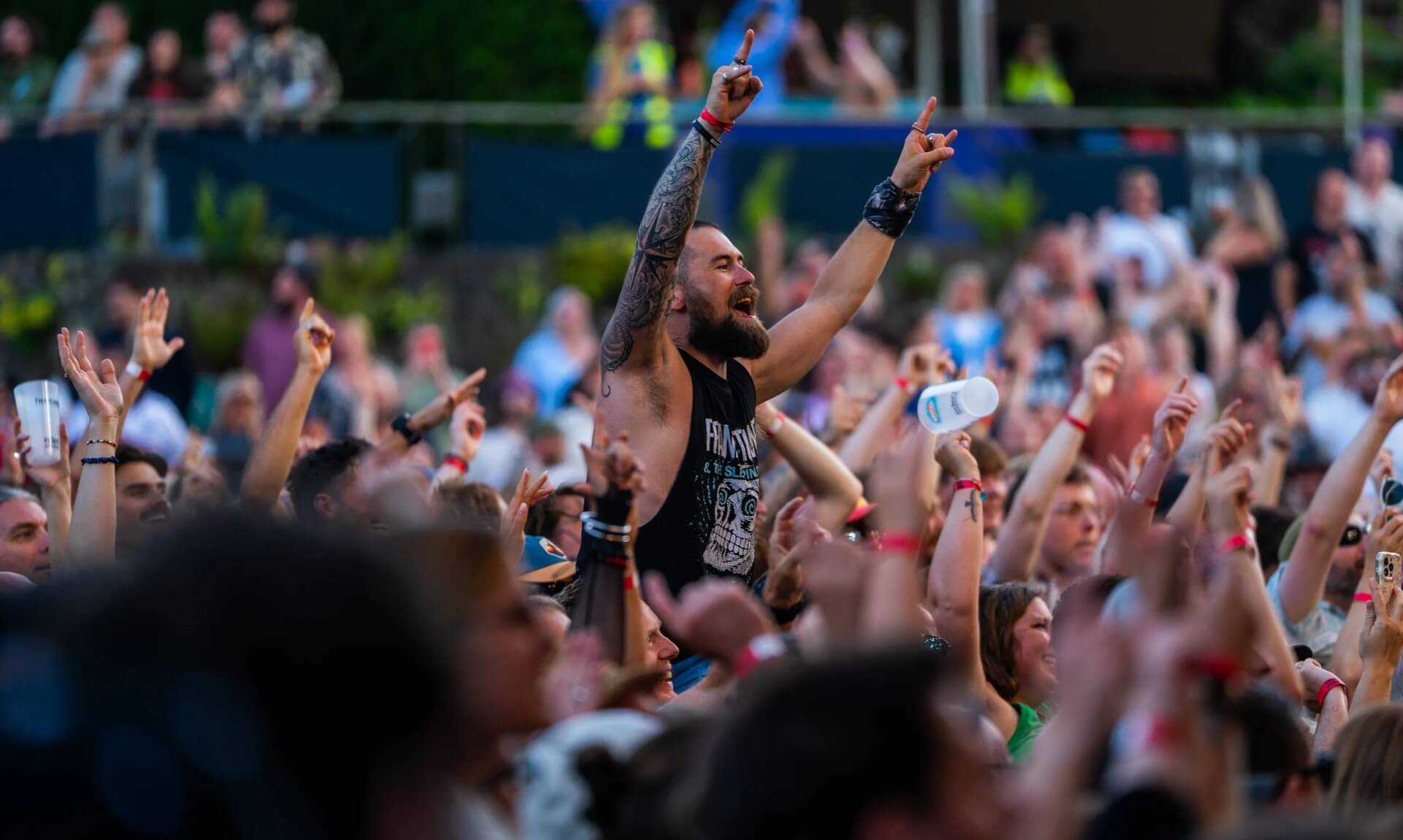 Fans cheering with arms raised in the crowd at the Eden Sessions 2026 (photo Rob Donald)