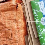 Flattened cardboard boxes bundled for recycling collection in Cornwall