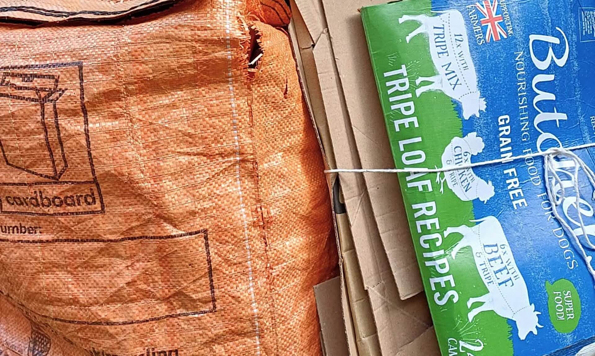 Flattened cardboard boxes bundled for recycling collection in Cornwall