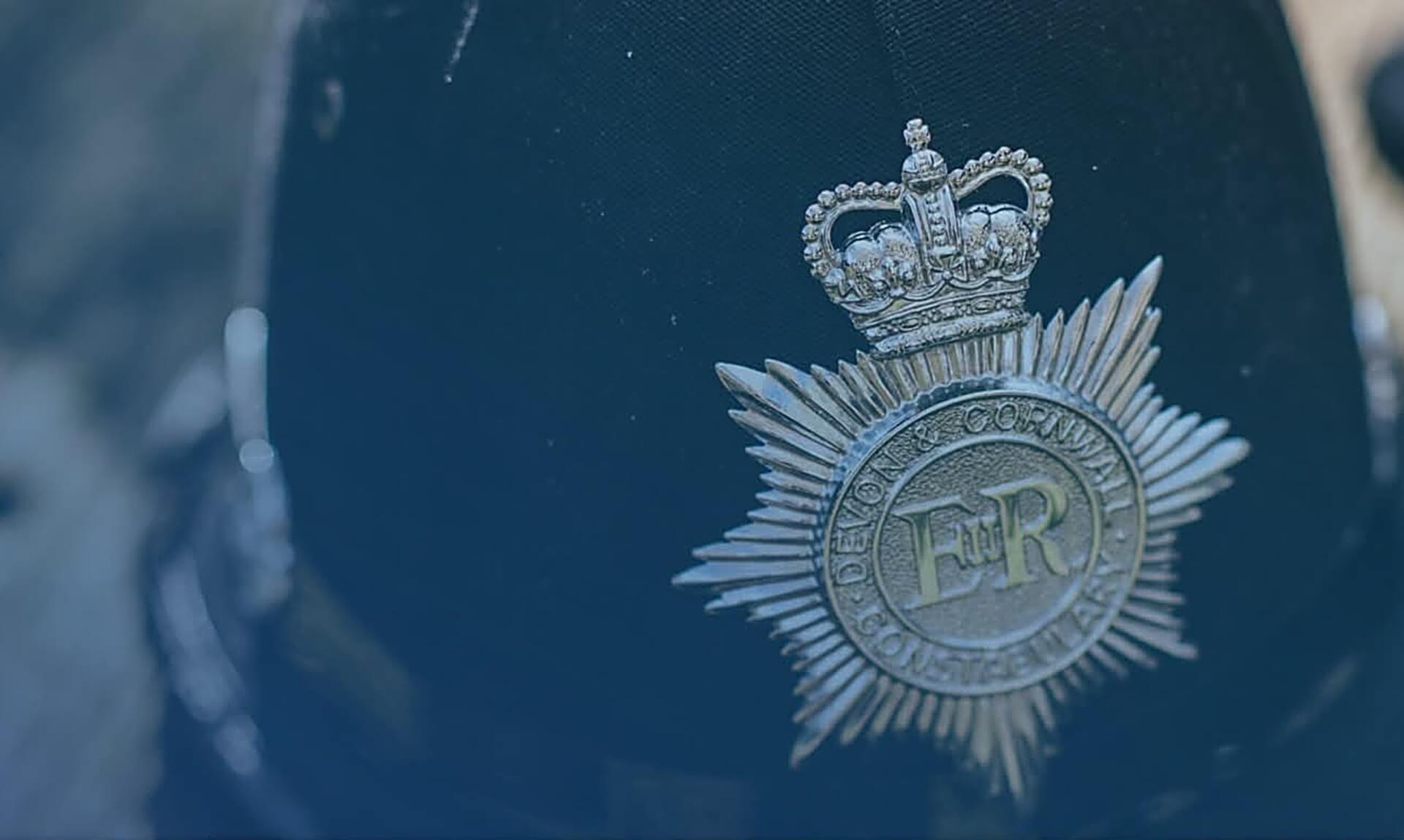 Devon and Cornwall Police badge on an officer's cap