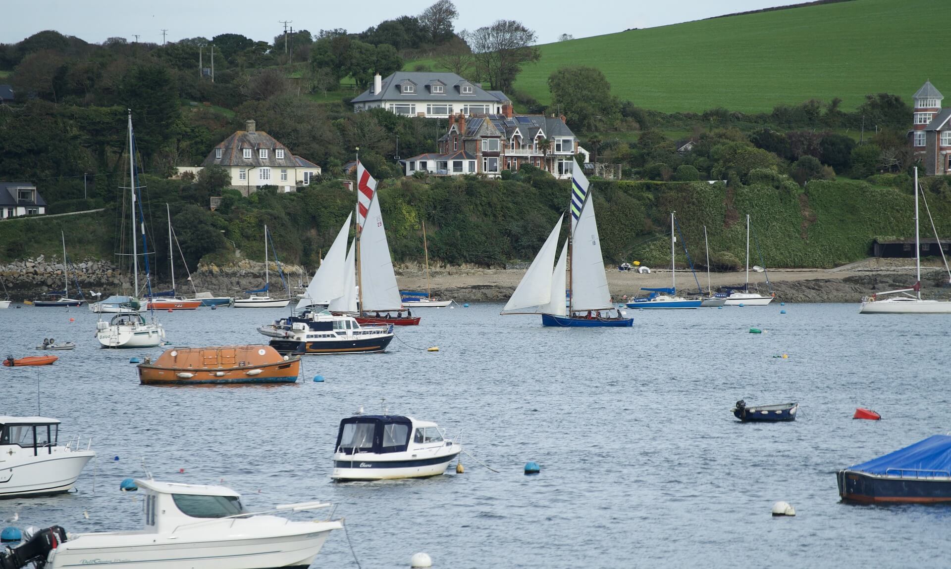 Traditional sailing working boats moored in Falmouth harbour