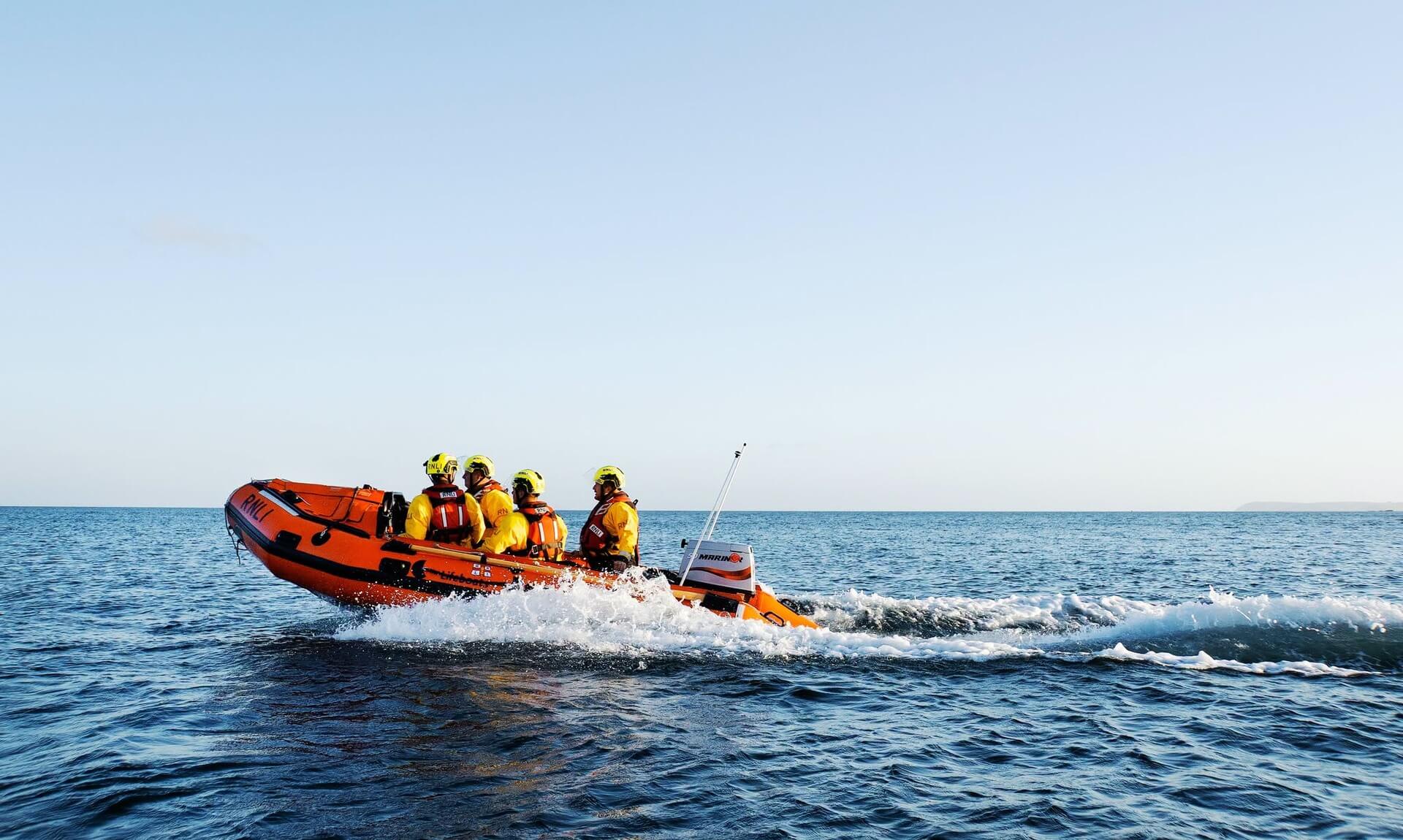 Fowey RNLI inshore lifeboat crew at sea