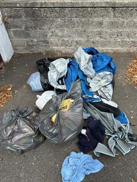 The full pile of rubbish, tents and clothing collected by police from Golddiggings near Minions
