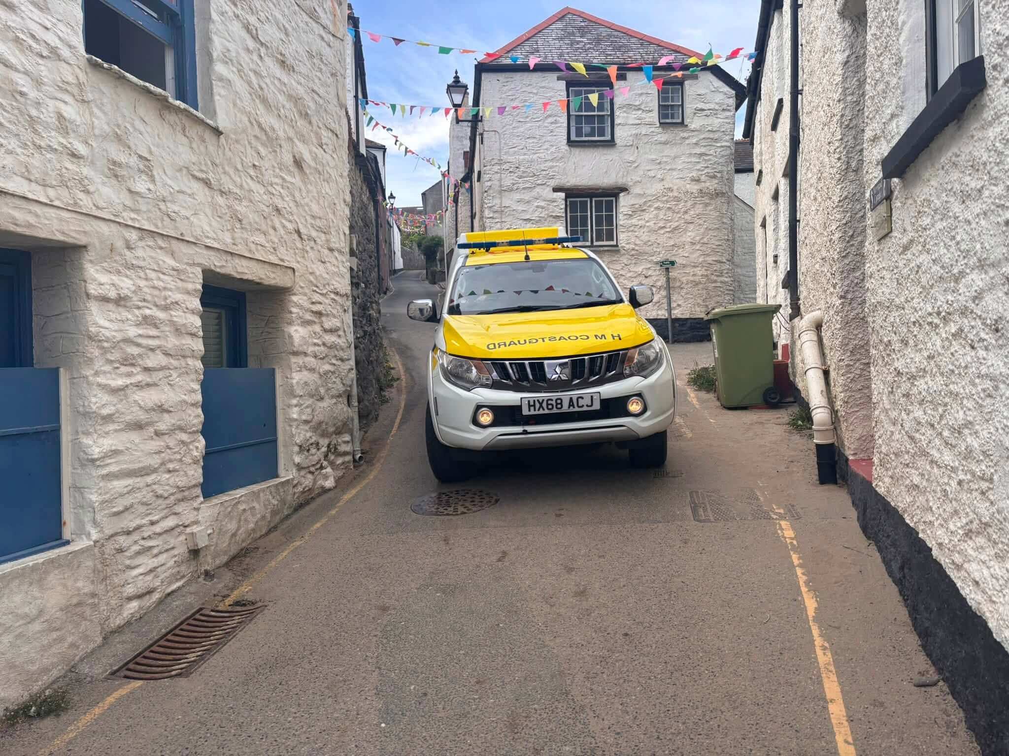 HM Coastguard vehicle in a narrow Cornish street