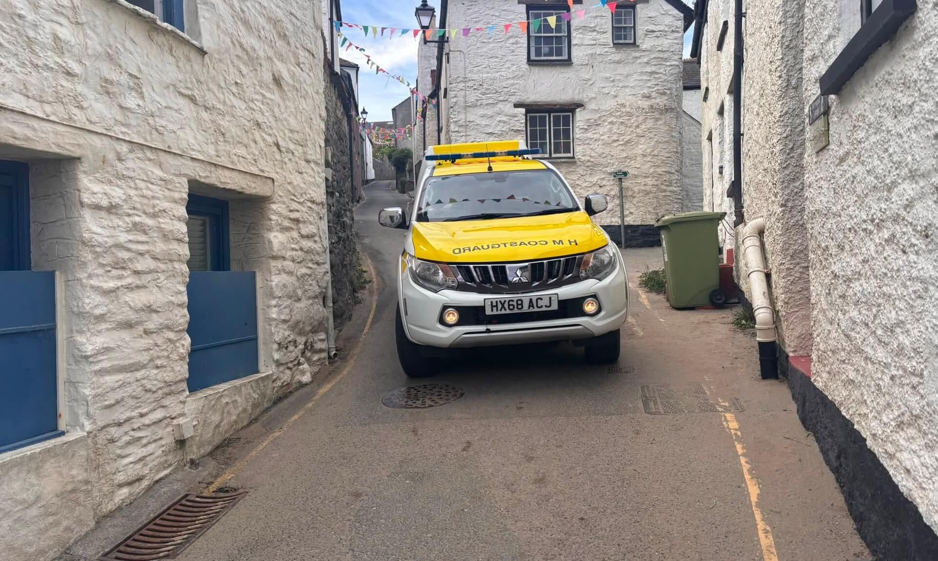 HM Coastguard vehicle in a narrow Cornish street