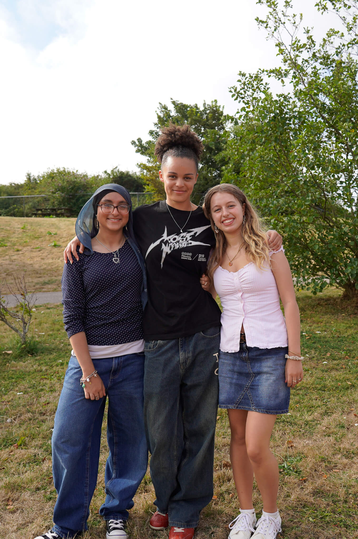 Three Camborne Sixth Form students who secured medicine places stand together outside the college