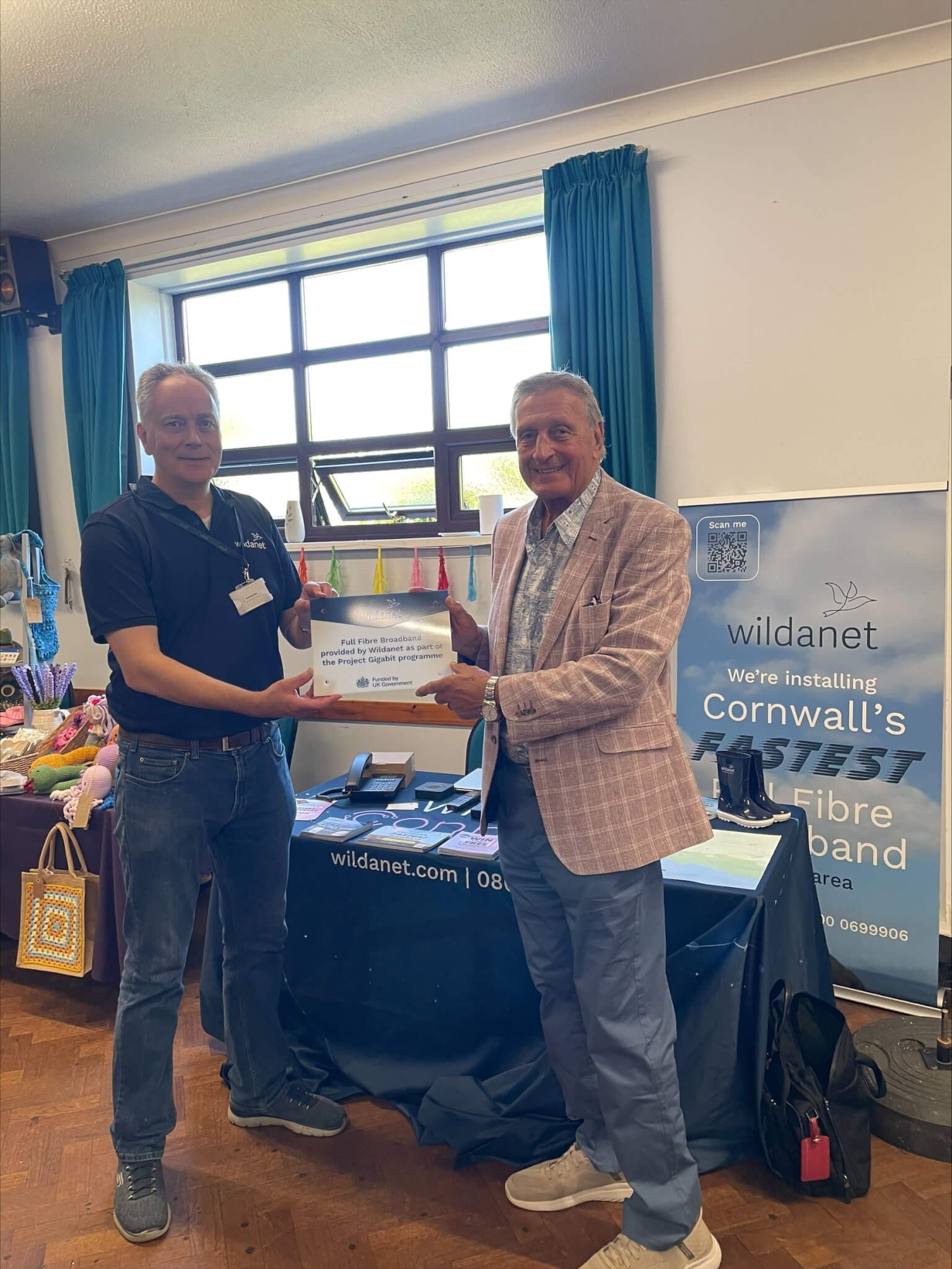 Peter Thompson and Simon Hughes indoors at Praa Sands Community Centre holding the Wildanet plaque