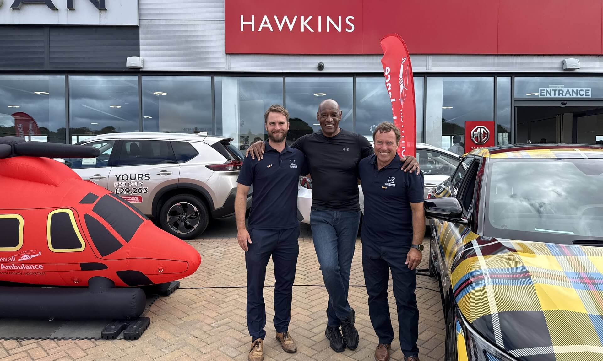 Shaun Wallace with James Hawkins and Jack Hawkins outside Hawkins Blackwater