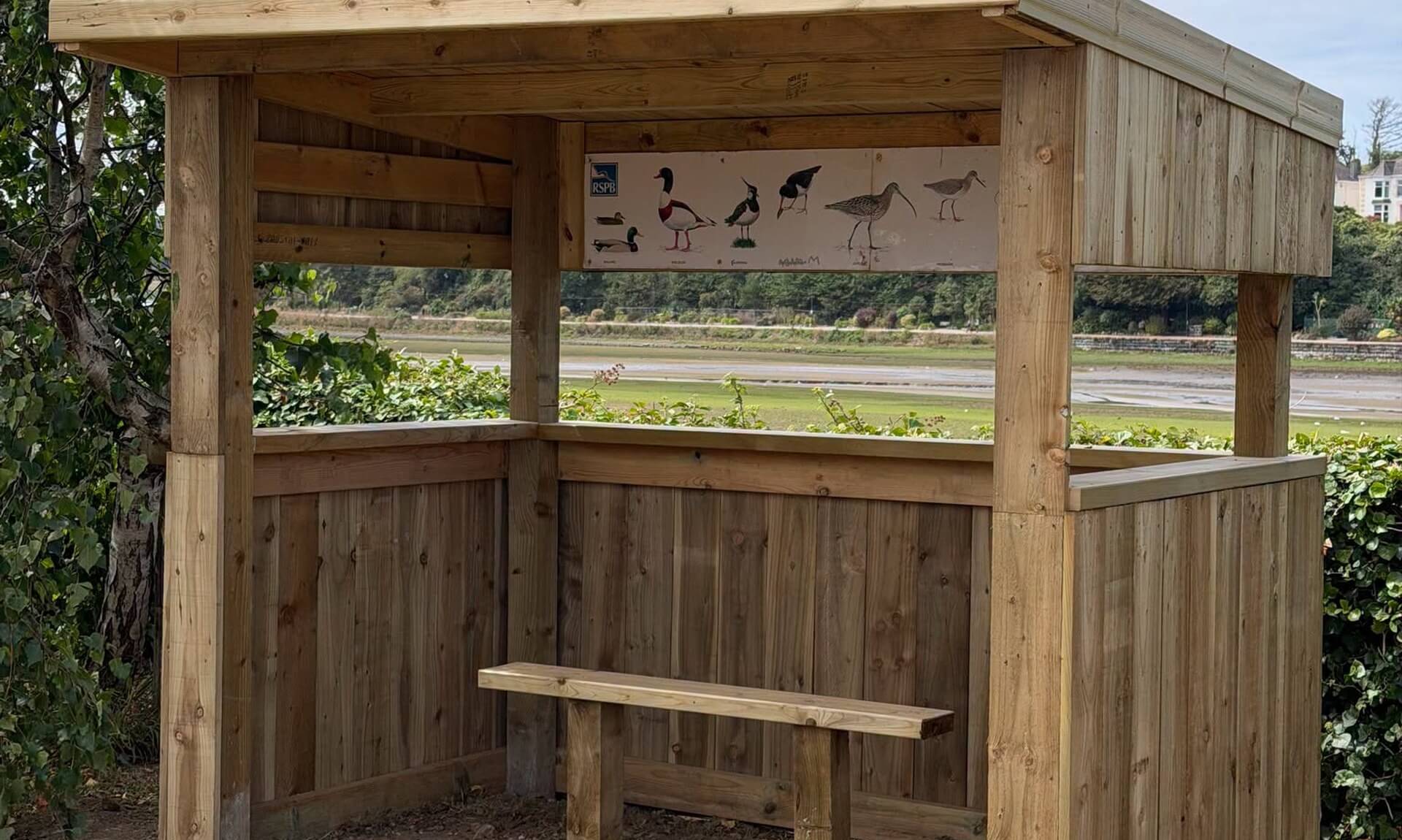 New timber bird hide beside Hayle Library looking out over the estuary