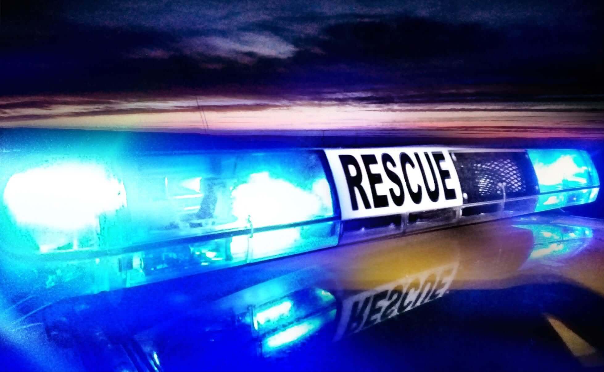 Blue rescue lights on a coastguard vehicle at night