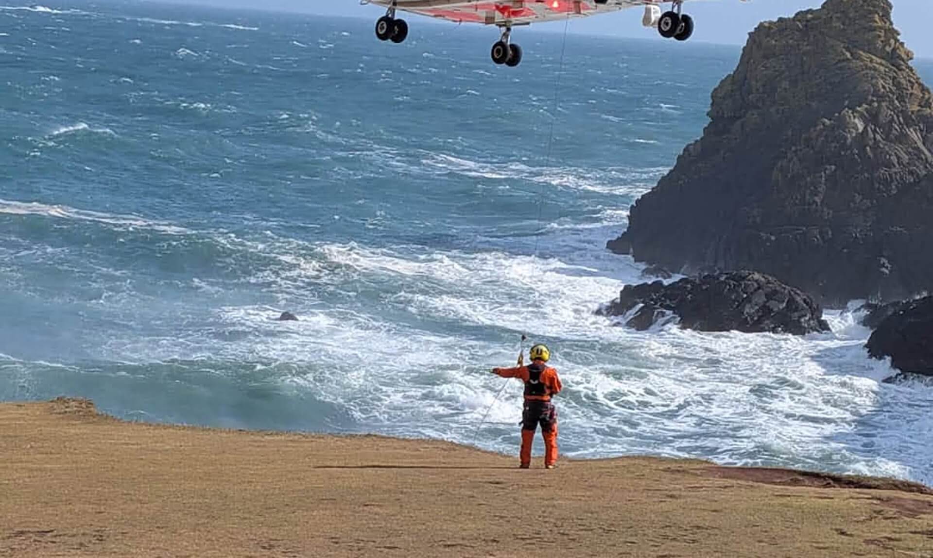 HM Coastguard rescue helicopter SAR 924 winching near Kynance Cove