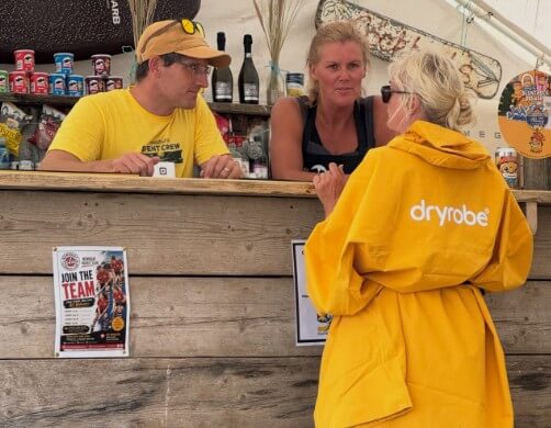 Volunteers at the DryRobe sponsor tent at Holywell Bay