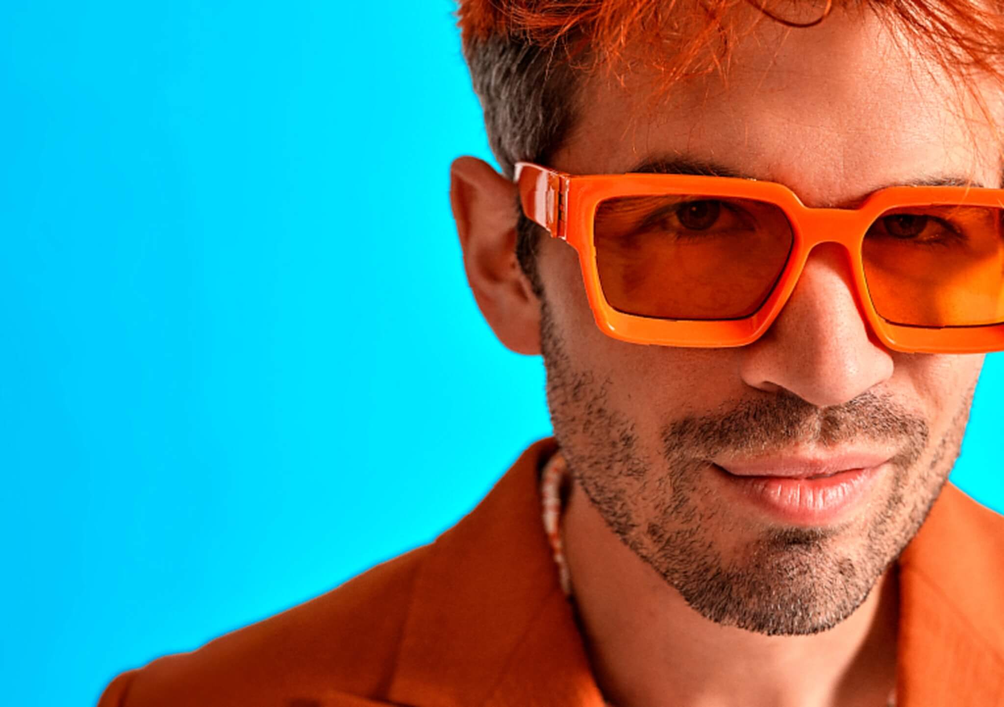 Ivo Graham wearing orange sunglasses for his Orange Crush tour