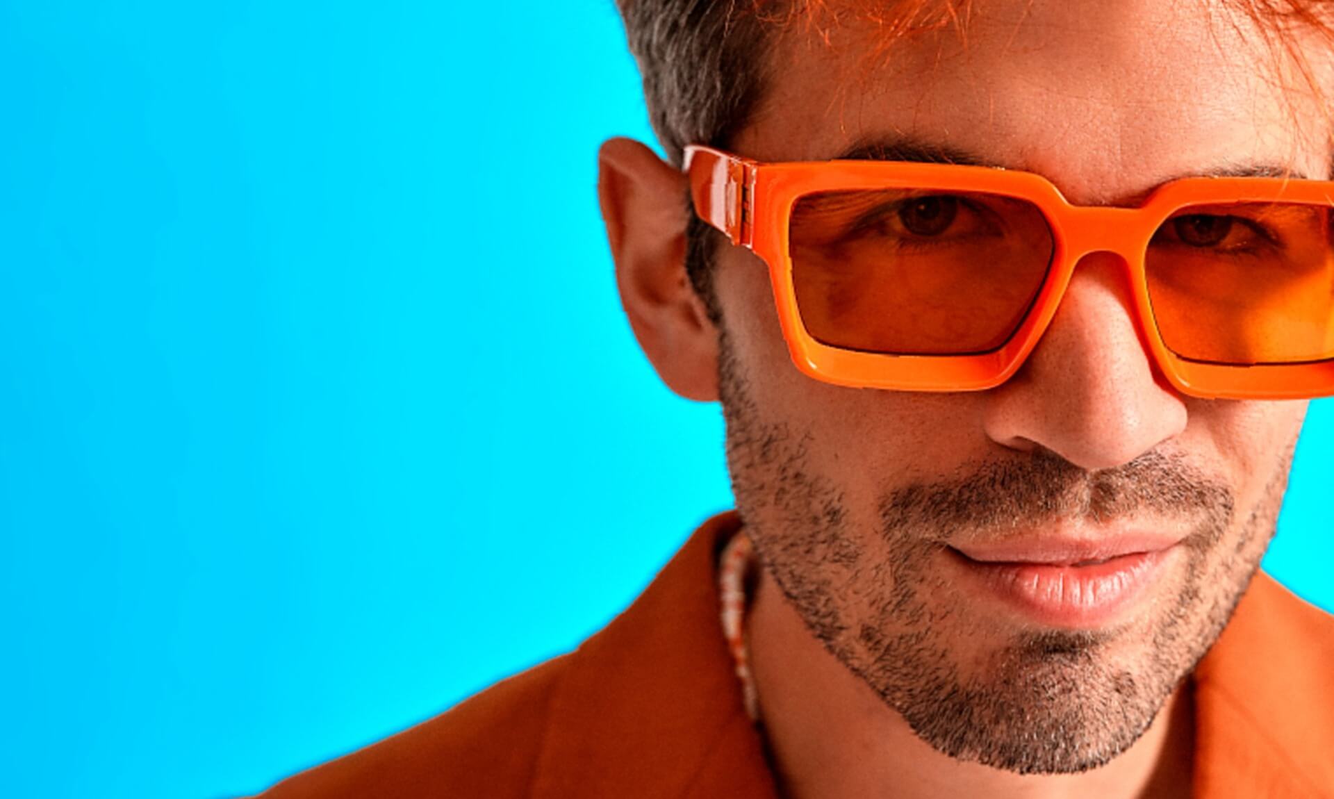 Ivo Graham wearing orange sunglasses for his Orange Crush tour